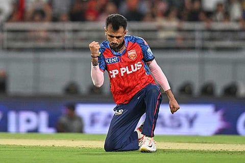 Punjab Kings' Yuzvendra Chahal celebrates the wicket of Rajasthan Royals' captain Riyan Parag during the Indian Premier League cricket match between Rajasthan Royals and Punjab Kings in New Chandigarh, India.
