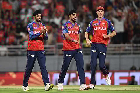 Punjab Kings' Arshdeep Singh, centre, celebrates with teammates the wicket of Rajasthan Royals' Vaibhav Sooryavanshi during the Indian Premier League cricket match between Rajasthan Royals and Punjab Kings in New Chandigarh, India.