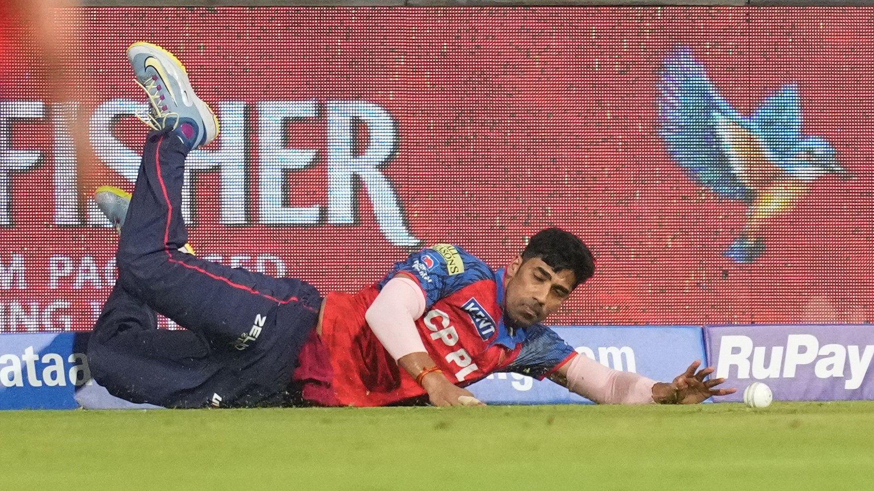 Punjab Kings' Shashank Singh dives to save a boundary during the Indian Premier League cricket match between Mumbai Indians and Punjab Kings in Mumbai, India, Thursday, April 16, 2026. - | Photo: AP/Rafiq Maqbool