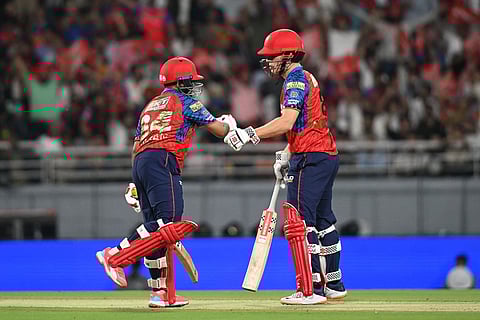 Punjab Kings' Prabhsimran Singh, left, and his batting partner Cooper Connolly celebrates scoring runs during the Indian Premier League cricket match between Rajasthan Royals and Punjab Kings in New Chandigarh, India.