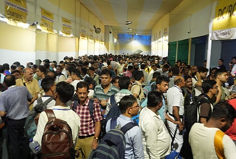 Polling officials collect Electronic Voting Machine (EVM) and Voter Verifiable Paper Audit Trail (VVPAT) units at a distribution centre, for voting in the second phase of the West Bengal Assembly elections, in Kolkata.