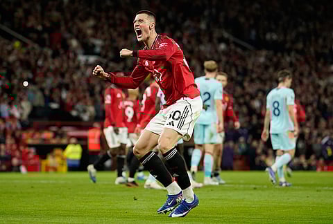 Manchester United's Benjamin Sesko celebrates after scoring during the Premier League soccer match between Manchester United and Brentford in Manchester, England.