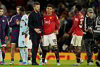 | Photo: AP/Dave Thompson : Manchester United's coach Michael Carrick talks to Casemiro, center, and Kobbie Mainoo after the Premier League soccer match between Manchester United and Brentford in Manchester, England.