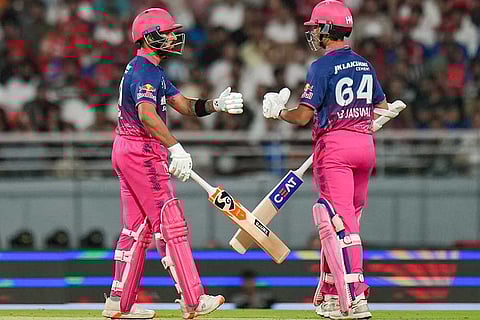 Rajasthan Royals' Yashasvi Jaiswal, right, and Dhruv Jurel interact between the wickets during the Indian Premier League (IPL) 2026 T20 cricket match between Punjab Kings and Rajasthan Royals, in Mullanpur.
