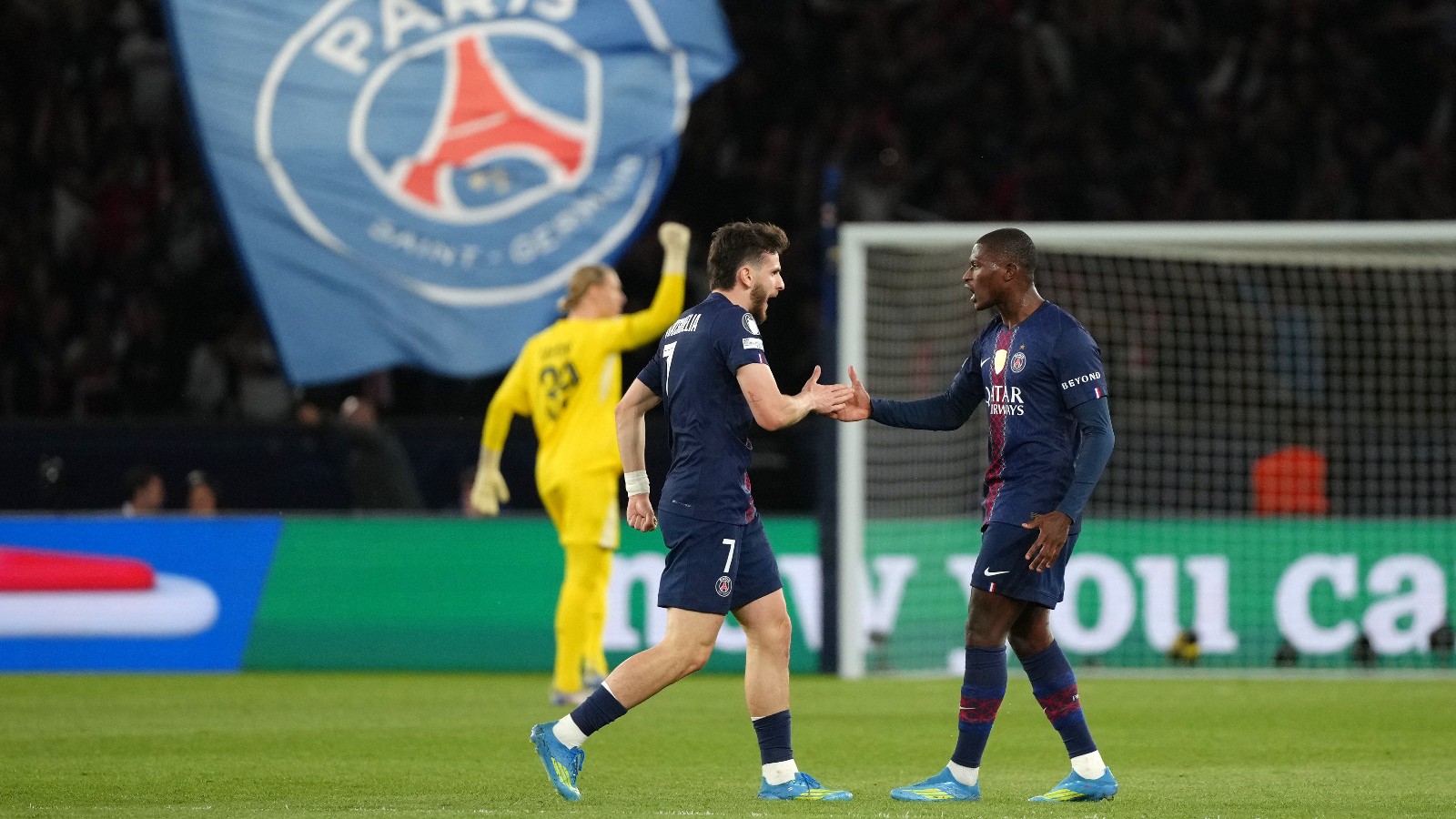PSG's Khvicha Kvaratskhelia celebrates with Nuno Mendes, right, after scoring his side's first goal during a Champions League semifinal, first leg, soccer match between Paris Saint-Germain and Bayern Munich in Paris. - AP Photo