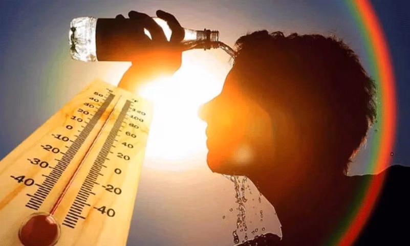 A person pouring water on their face in extreme heat