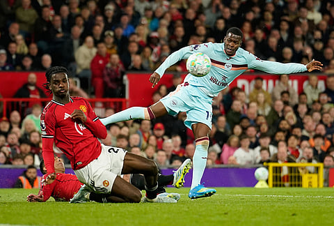 Brentford's Dango Ouattara shoots during the Premier League soccer match between Manchester United and Brentford in Manchester, England.