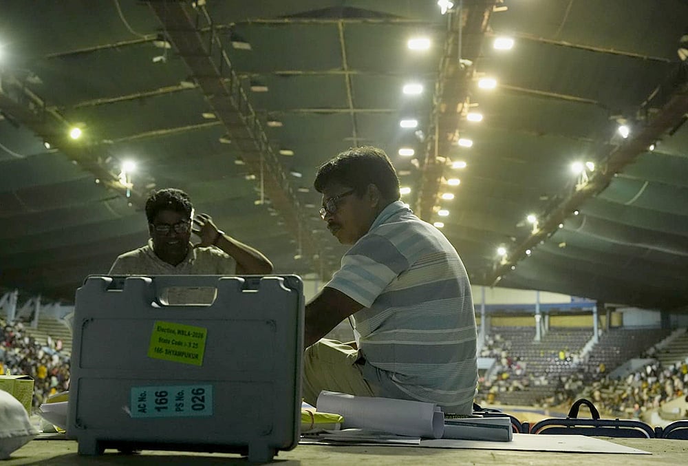 Polling officials check election materials for voting in the second phase of the West Bengal Assembly elections, at a distribution centre in Kolkata. - | Photo: Sandipan Chatterjee/Outlook