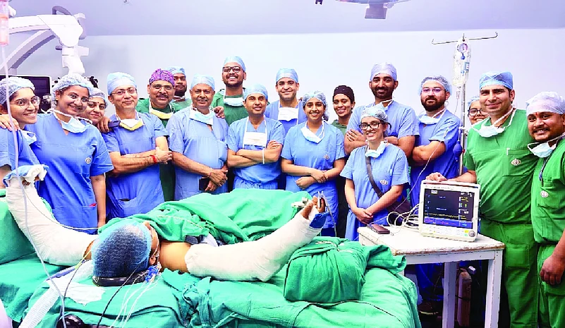 A hand transplant patient with the medical team