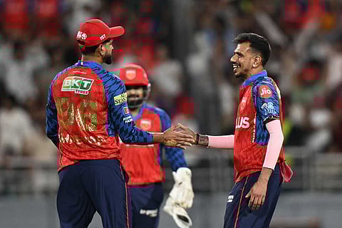 Punjab Kings' Yuzvendra Chahal, right, and Punjab Kings' captain Shreyas Iyer celebrates the wicket of Rajasthan Royals' Dhruv Jurel during the Indian Premier League cricket match between Rajasthan Royals and Punjab Kings in New Chandigarh, India.