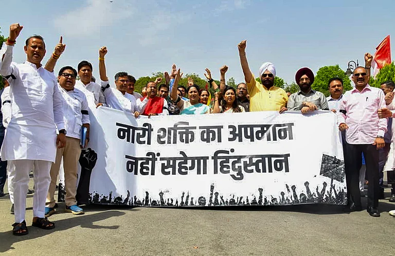 Delhi Chief Minister Rekha Gupta with BJP leaders, takes part in a protest rally over "Nari Shakti Vandan Adhiniyam" - PTI