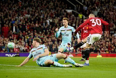 Manchester United's Benjamin Sesko scores during the Premier League soccer match between Manchester United and Brentford in Manchester, England.
