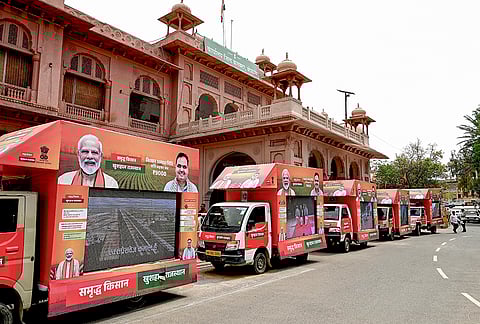 Mobile trucks parked in a row during the flagging off ceremony of Gram Rath campaign, a statewide initiative to raise awareness about government schemes in rural areas, in Bikaner, Rajasthan.