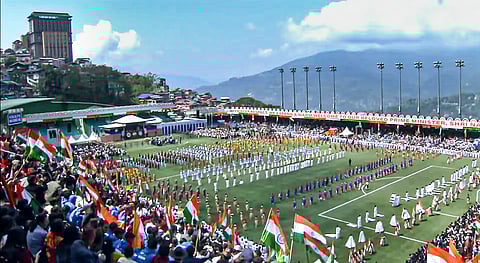 People gather to attend the closing ceremony of Sikkim's 50th year of statehood celebrations, at Paljor Stadium, in Gangtok, Sikkim. 