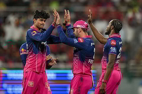 Rajasthan Royals' Yashraj Punja, left, celebrates with teammates after taking the wicket of Punjab Kings' Cooper Connolly during the Indian Premier League (IPL) 2026 T20 cricket match between Punjab Kings and Rajasthan Royals, in Mullanpur.