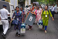 | Photo: PTI/Manvender Vashist Lav : Officials leave for their respective polling stations after collecting Electronic Voting Machine (EVM) and Voter Verifiable Paper Audit Trail (VVPAT) units for voting in the second phase of the West Bengal Assembly elections, in Kolkata.