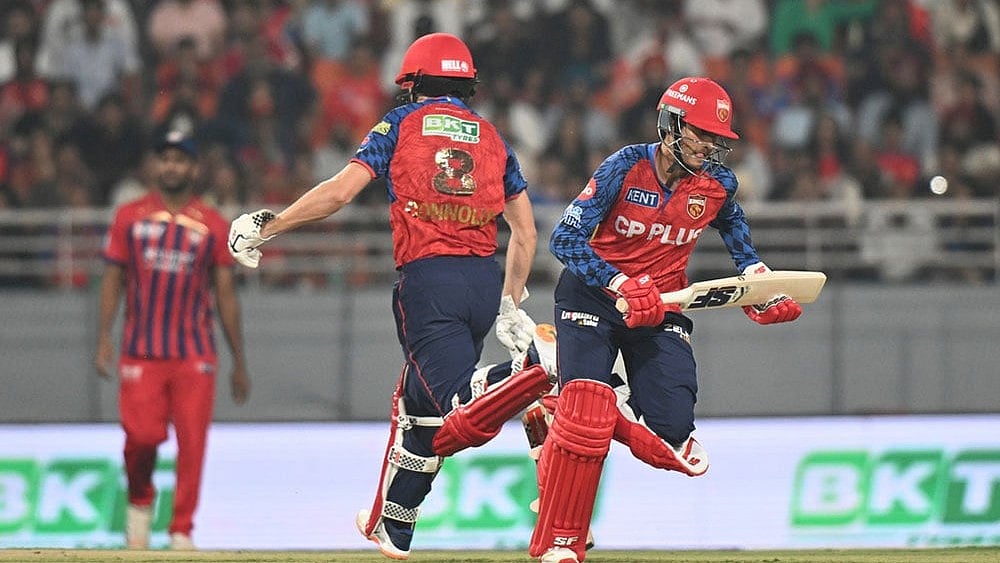 Punjab Kings' Priyansh Arya, right, and his batting partner Cooper Connolly run between the wickets during the Indian Premier League cricket match between Punjab Kings and Lucknow Super Giants in New Chandigarh, India. - | Photo: AP