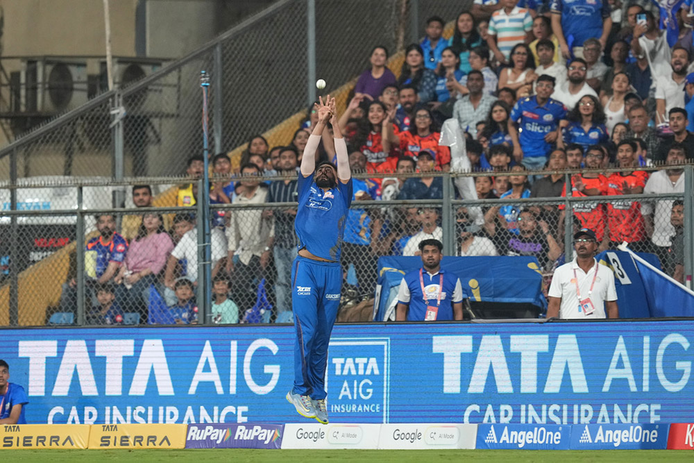Mumbai Indians' Naman Dhir jumps up in the air to catch the ball unsuccessfully during the Indian Premier League cricket match between Mumbai Indians and Sunrisers Hyderabad in Mumbai, India.