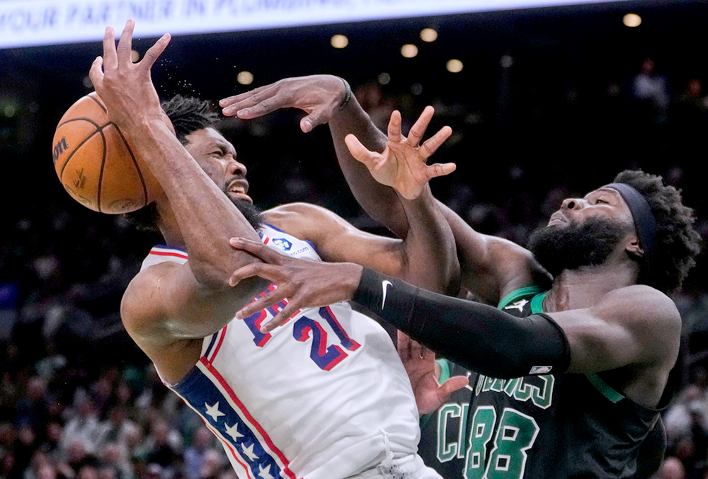 Boston Celtics center Neemias Queta (88) pressures Philadelphia 76ers center Joel Embiid (21) during the second half of Game 5 of a first-round NBA playoffs basketball series, in Boston. 