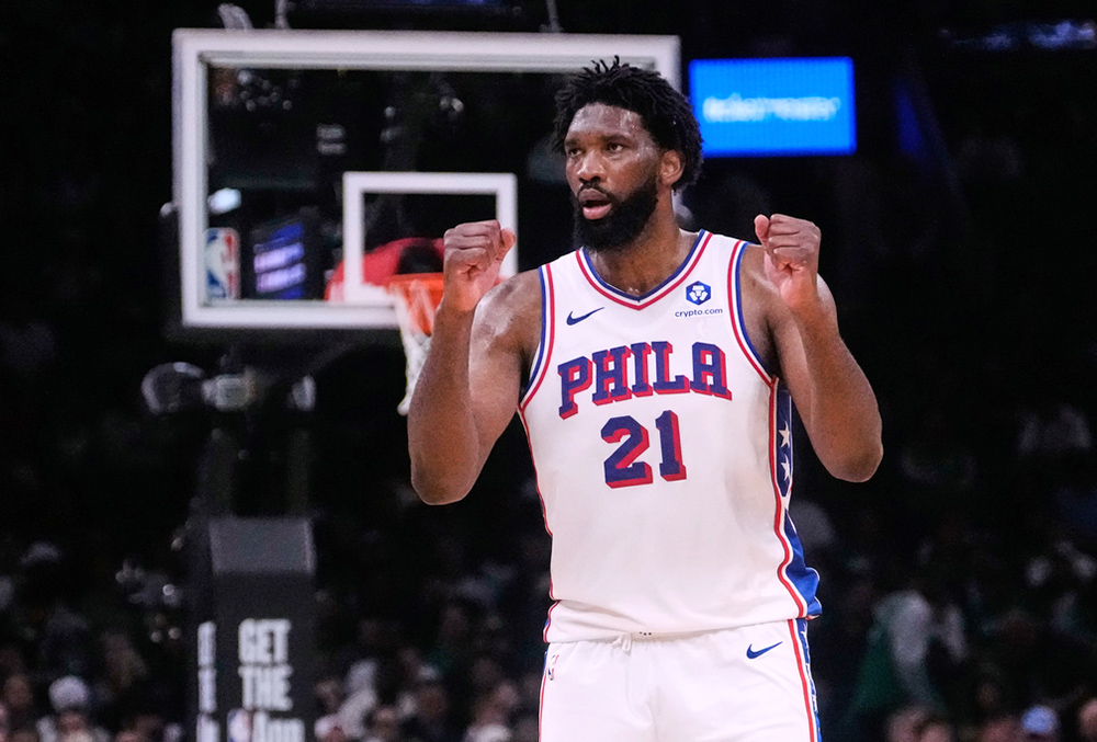 Philadelphia 76ers center Joel Embiid (21) pumps his fists after making a basket against the Boston Celtics during the second half of Game 5 of a first-round NBA playoffs basketball series, in Boston. 