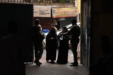 Security check underway during voting in the second and final phase of the West Bengal Assembly elections, at a polling station in Kolkata.