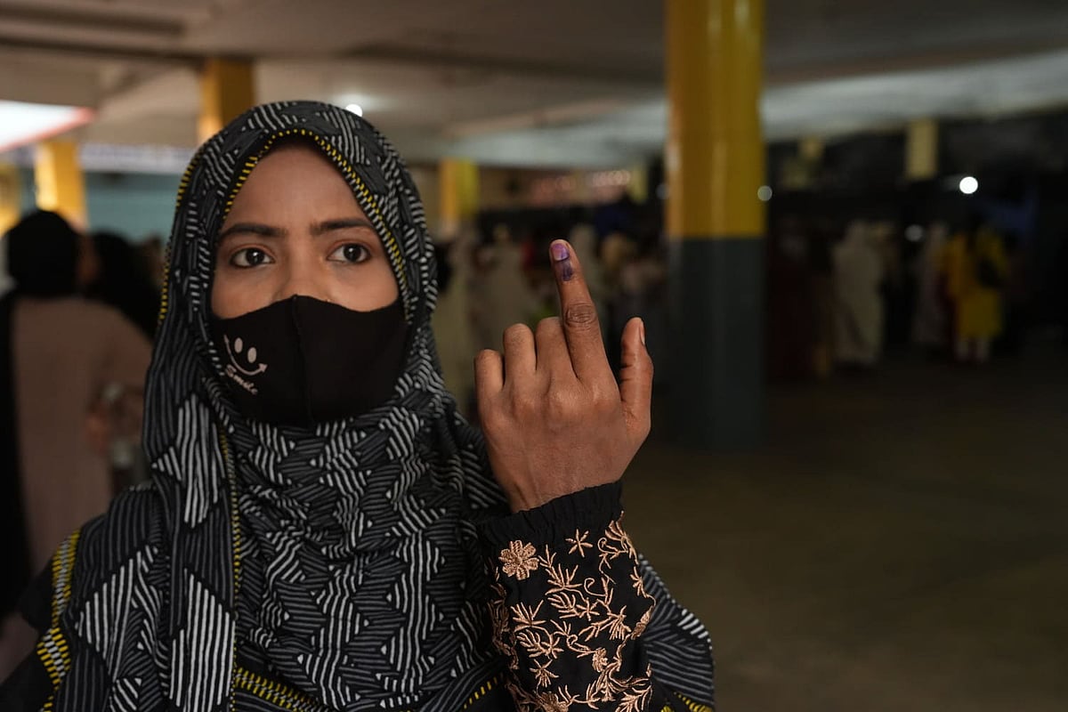 woman shows her ink-marked finger