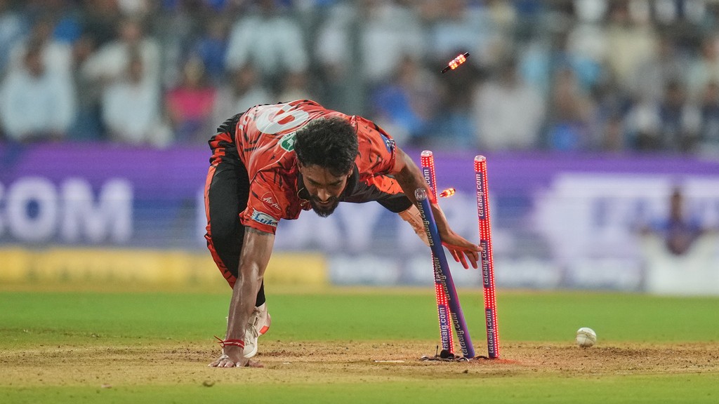 Praful Hinge attempts unsuccessfully runout for the wicket of Ryan Rickelton during the Indian Premier League match between Mumbai Indians and Sunrisers Hyderabad in Mumbai.