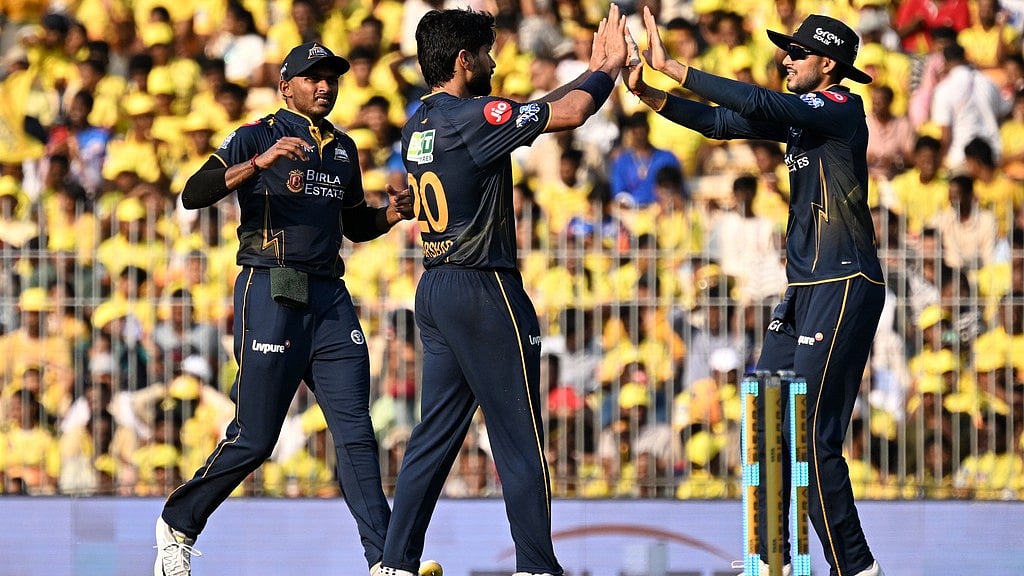 Arshad Khan, centre, celebrates with captain Shubman Gill, right, the wicket of Shivam Dube during the Indian Premier League match between Chennai Super Kings and Gujarat Titans in Chennai. - AP