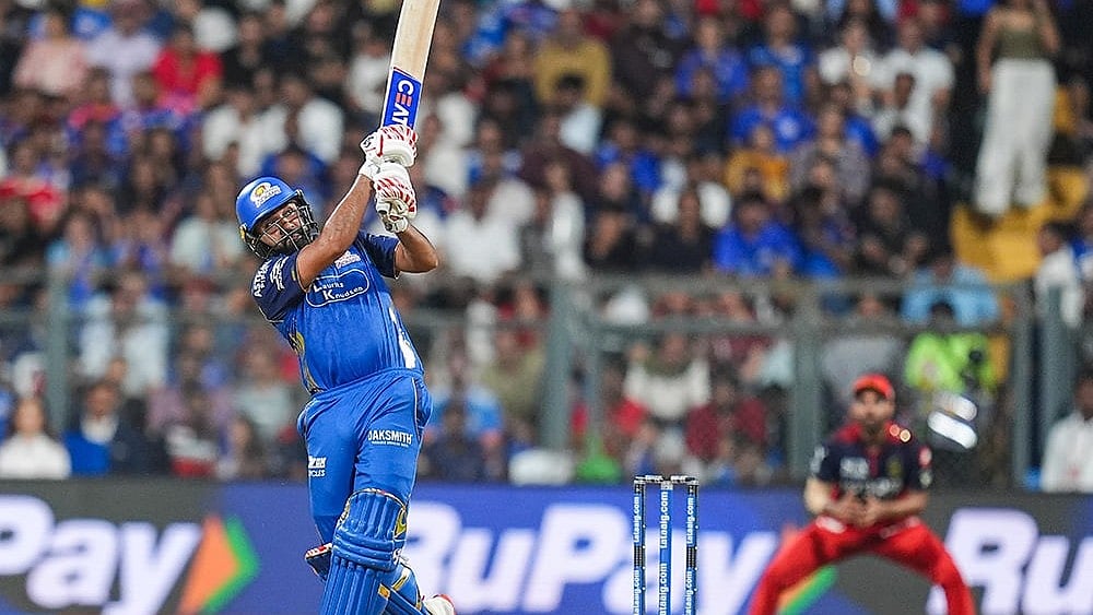 Mumbai Indians' Rohit Sharma plays a shot during an Indian Premier League (IPL) 2026 T20 cricket match between Mumbai Indians and Royal Challengers Bengaluru, in Mumbai, Maharashtra. - | Photo: PTI/Kunal Patil