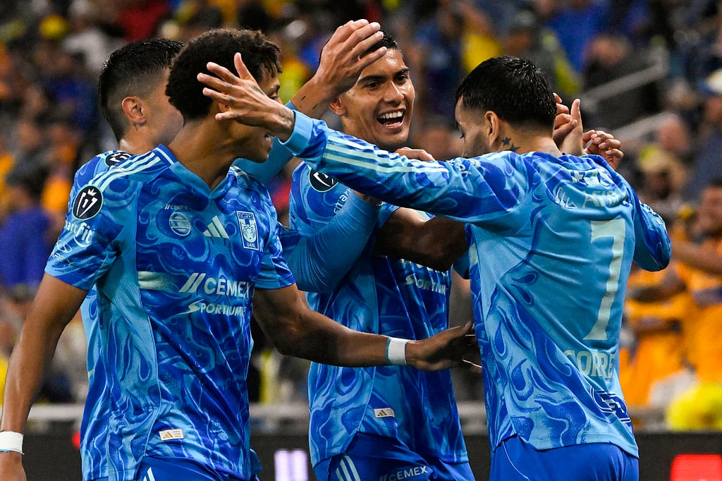 UANL Tigres forward Ángel Correa, right, celebrates his goal against Nashville SC with Francisco Reyes, second from right, and other team mates during the first half of an CONCACAF Champions Cup first leg semifinal soccer match in Nashville, Tennessee.  - | Photo: AP/John Amis