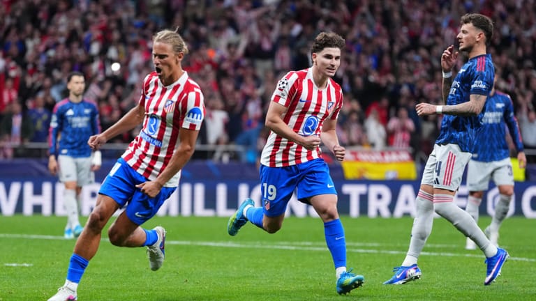 Atletico Madrid's Julian Alvarez, center, celebrates after scoring his sides first goal during a Champions League semifinal, first leg, soccer match between Atletico Madrid and Arsenal in Madrid. - AP Photo