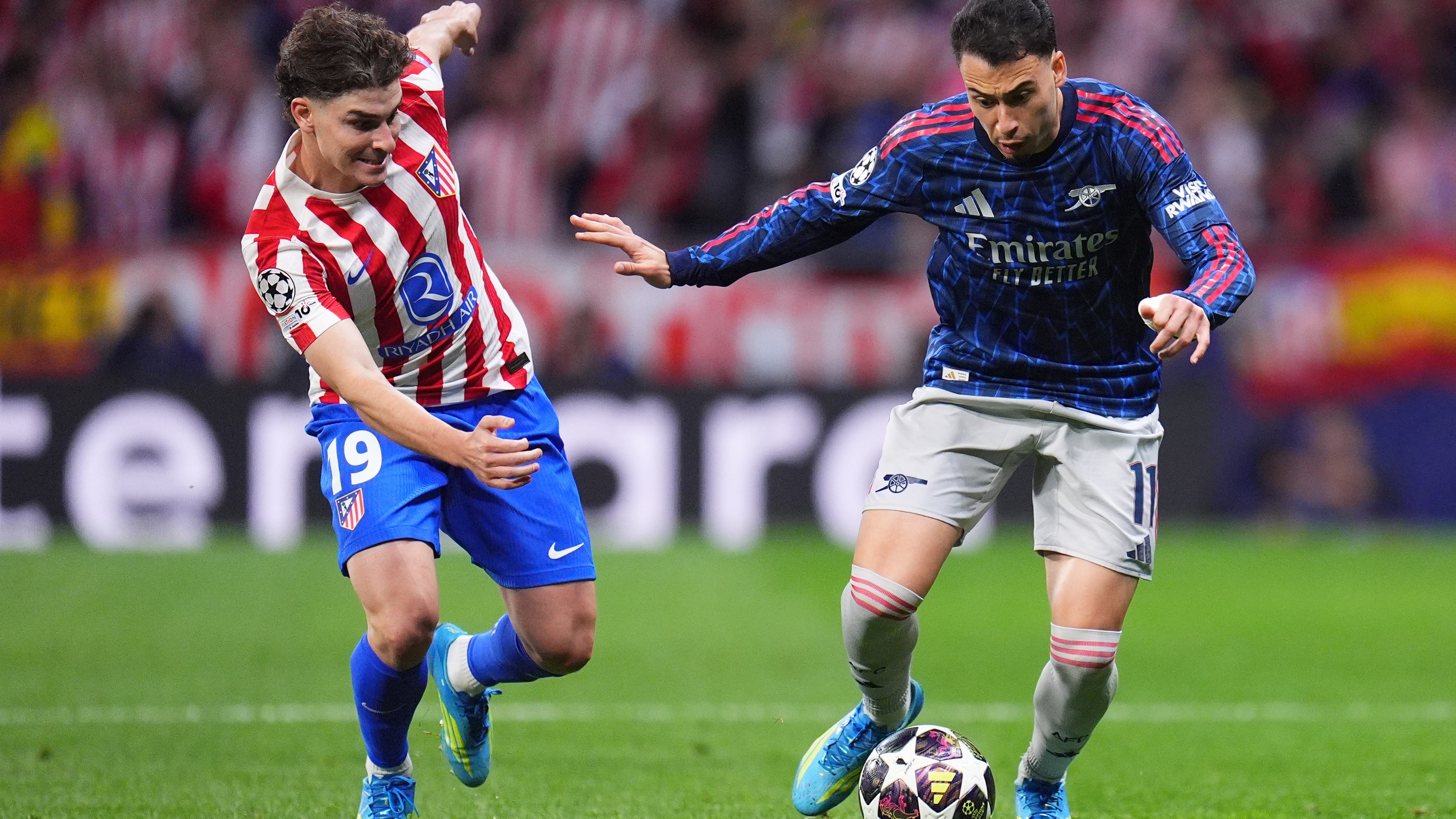 Atletico Madrid's Julian Alvarez, left, challenges Arsenal's Gabriel Martinelli during a Champions League semifinal, first leg, soccer match between Atletico Madrid and Arsenal in Madrid. - AP Photo