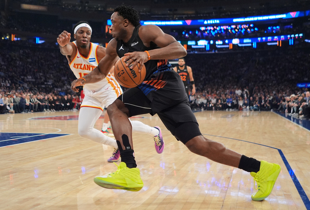 New York Knicks' OG Anunoby, right, drives past Atlanta Hawks' Onyeka Okongwu during the first half in Game 5 of a first-round NBA playoffs basketball series, in New York. 