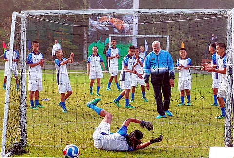 Prime Minister Narendra Modi plays football with youngsters during his visit to Sikkim, in Gangtok.