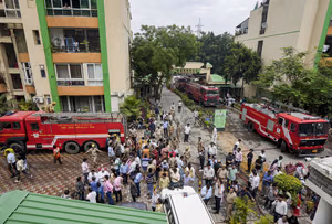 | Photo: PTI/Kamal Kishore : Fire brigade vehicles at the site after a fire broke out in Green Avenue Society, Indirapuram, Ghaziabad.