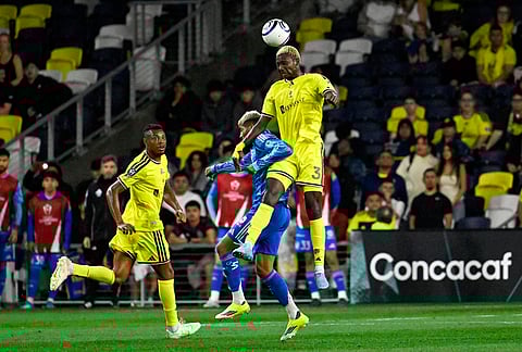 Nashville SC 2026 defender Maxwell Woledzi (3) gets a header over UANL Tigres midfielder Rodrigo Aguirre (17) during the second half of an CONCACAF Champions Cup first leg semifinal soccer match in Nashville, Tennessee.
