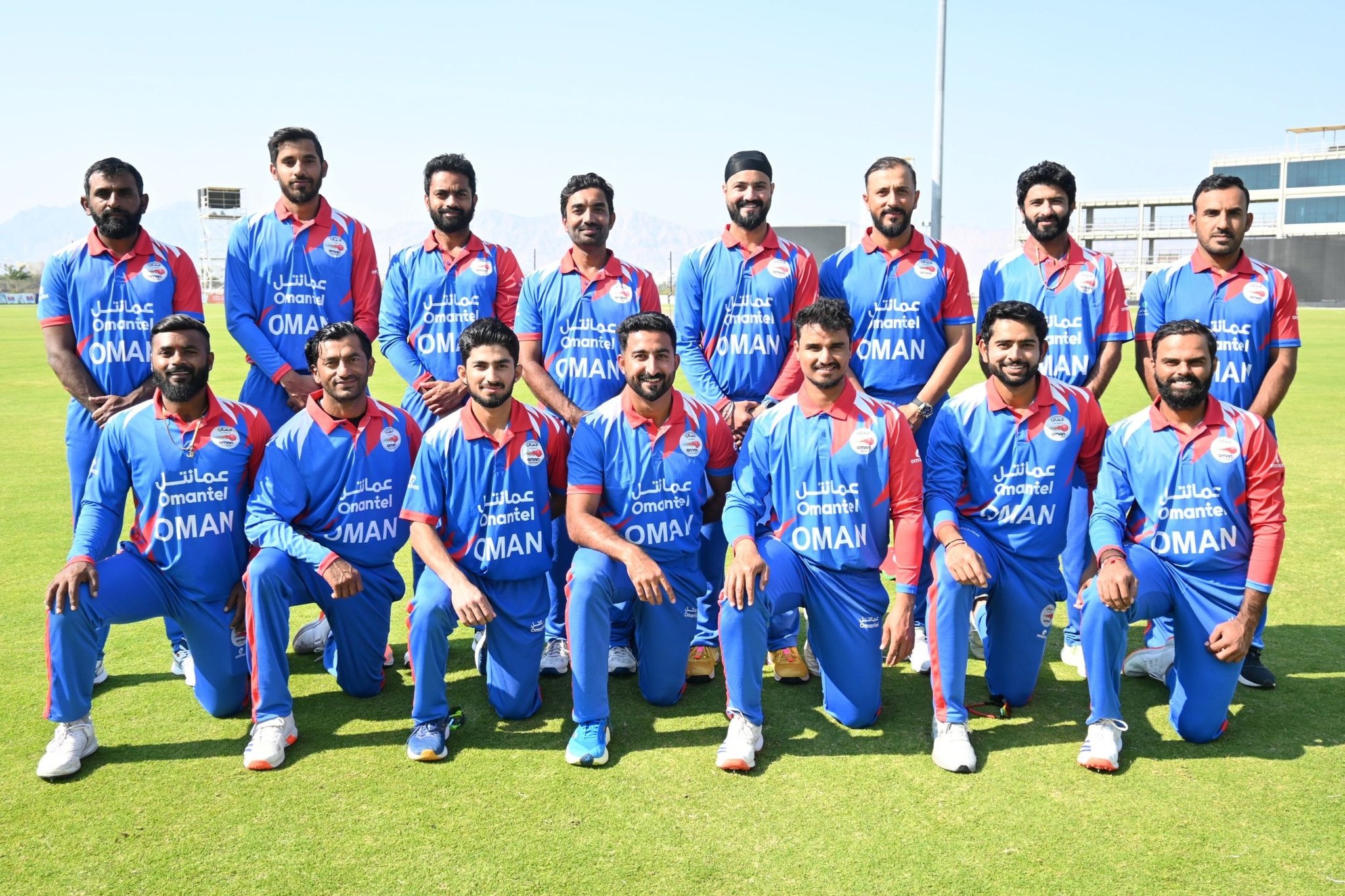 Oman cricket team posing for a photo. - X/TheOmanCricket