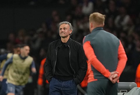 PSG's head coach Luis Enrique and Bayern assistant coach Aaron Danks, foreground, stand by the touchline during a Champions League semifinal, first leg, soccer match between Paris Saint-Germain and Bayern Munich in Paris.