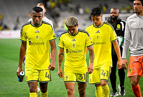 Nashville SC 2026 defender Jeisson Palacios (4), defender Andy Nájar (31), and forward Warren Madrigal (41) leave the field after losing to UANL Tigres in a CONCACAF Champions Cup first leg semifinal soccer match in Nashville, Tennessee.