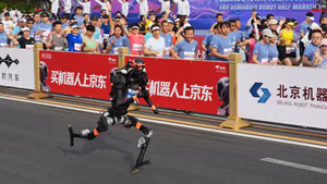 | Photo: AP/Ng Han Guan : A robot starts off for the Beijing E-Town Half Marathon and Humanoid Half Marathon on the outskirts of Beijing.