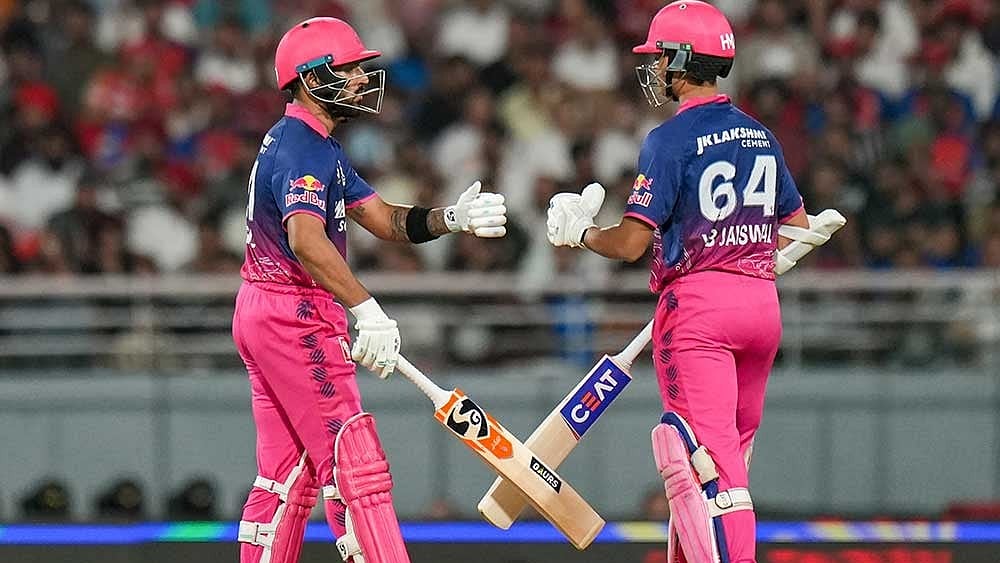 Rajasthan Royals' Yashasvi Jaiswal, right, and Dhruv Jurel interact between the wickets during the Indian Premier League (IPL) 2026 T20 cricket match between Punjab Kings and Rajasthan Royals, in Mullanpur. - | Photo: PTI/Shiva Sharma