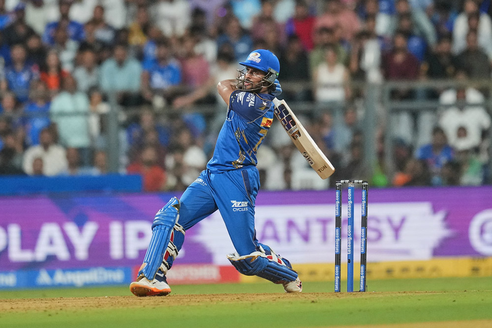 Mumbai Indians' Tilak Varma hits a six during the Indian Premier League cricket match between Mumbai Indians and Sunrisers Hyderabad in Mumbai, India.
