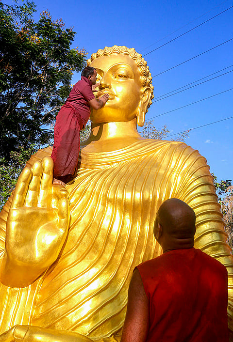 Preparations underway as monks clean a statue of Lord Buddha ahead of Buddha Jayanti, at Maitreya Buddha Mahavihar, in Bhopal, Madhya Pradesh.