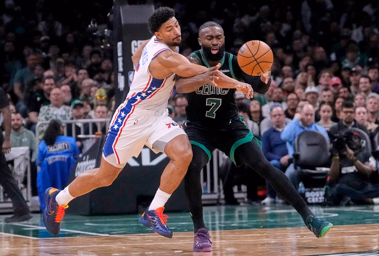 Philadelphia 76ers guard Quentin Grimes, left, knocks the ball free on a steal attempt against Boston Celtics guard Jaylen Brown (7) during the second half of Game 5 of a first-round NBA playoffs basketball series in Boston. - | Photo: AP/Charles Krupa