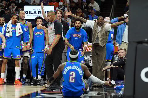 Oklahoma City Thunder guard Shai Gilgeous-Alexander (2) celebrates his score against the Phoenix Suns with teammates on the bench during the second half of Game 4 in a first-round NBA playoffs basketball series in Phoenix.