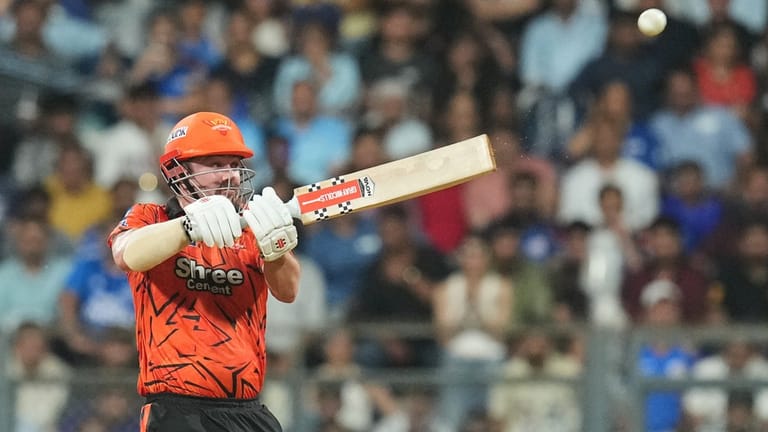 Travis Head plays a shot during the Indian Premier League match between Mumbai Indians and SunRisers Hyderabad in Mumbai. - AP
