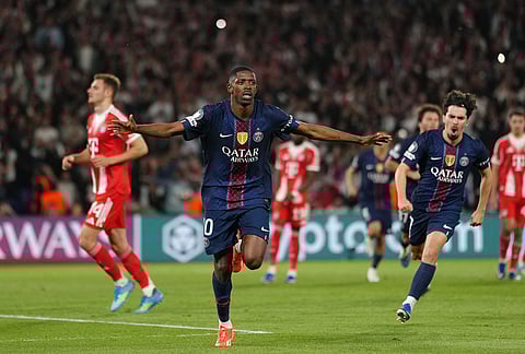 PSG's Ousmane Dembele celebrates after scoring his side's third goal during a Champions League semifinal, first leg, soccer match between Paris Saint-Germain and Bayern Munich in Paris.