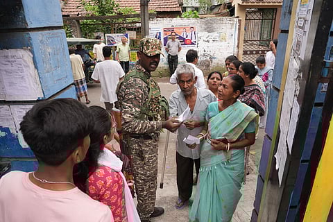 Security check underway during voting in the second and final phase of the West Bengal Assembly elections, at a polling station in Kolkata.