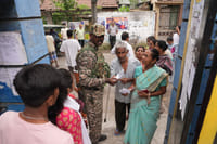 'Singham' Officer Keeps Vigil As Polling Underway In Bengal's South 24 Parganas | Photo: Sandipan chatterjee/Outlook | Representative Image : As voters turn out in steady numbers in Kolkata and its suburbs across communities in the second phase of polling, the city remains under the strict watch of central forces. People vote in the hope of solutions to long-standing civic issues, social gaps and unaddressed problems.