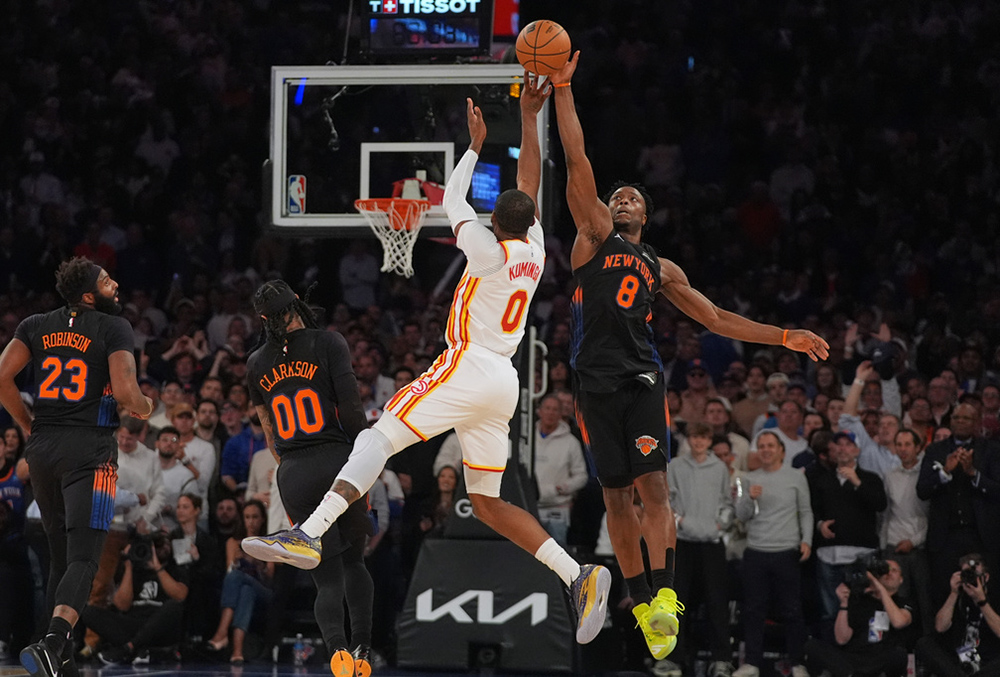 New York Knicks' Og Anunoby (8) blocks a shot by Atlanta Hawks' Jonathan Kuminga (0) during the first half in Game 5 of a first-round NBA playoffs basketball series, Tuesday, April 28, 2026, in New York. 